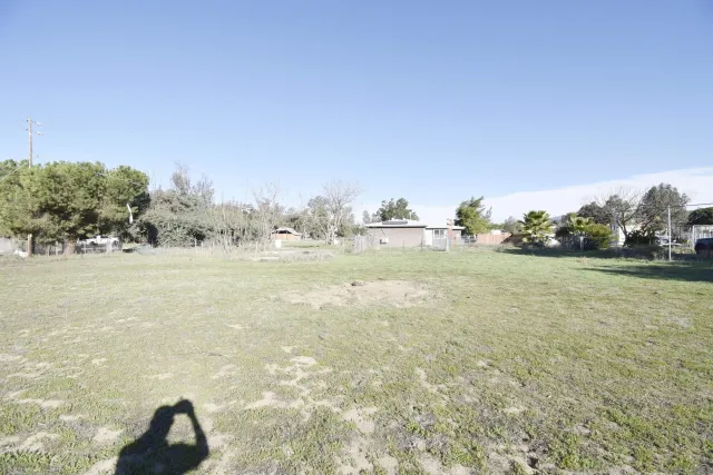 a view of open space with yard