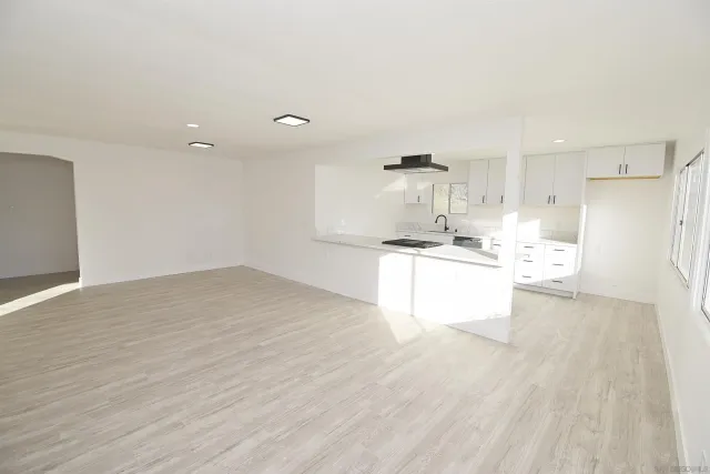 a view of kitchen with wooden floor
