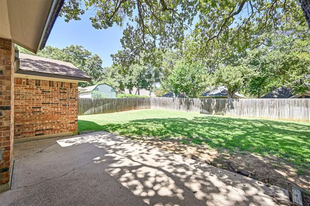 a view of a back yard of the house