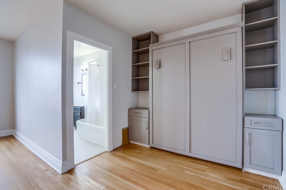 315 West 3rd Street, Unit 507 Long Beach, CA 90802 - Photo 15 of 25 a view of an empty room with wooden floor and closet