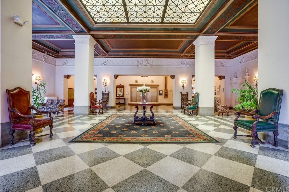 315 West 3rd Street, Unit 507 Long Beach, CA 90802 - Photo 3 of 25 a view of a hallway with a dining table and chairs
