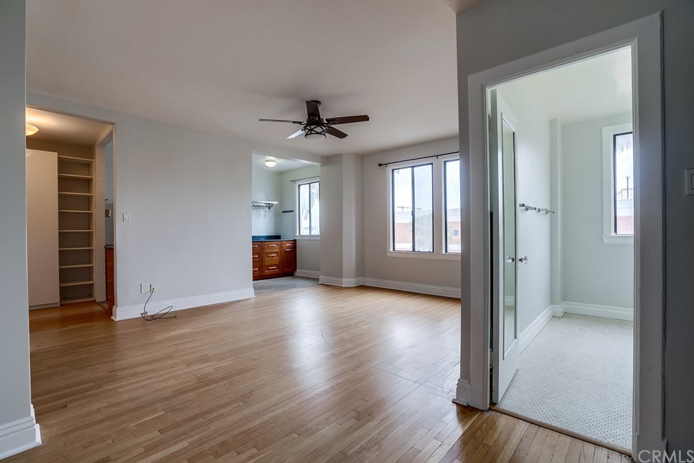 315 West 3rd Street, Unit 507 Long Beach, CA 90802 - Photo 6 of 25 wooden floor in an empty room with a window