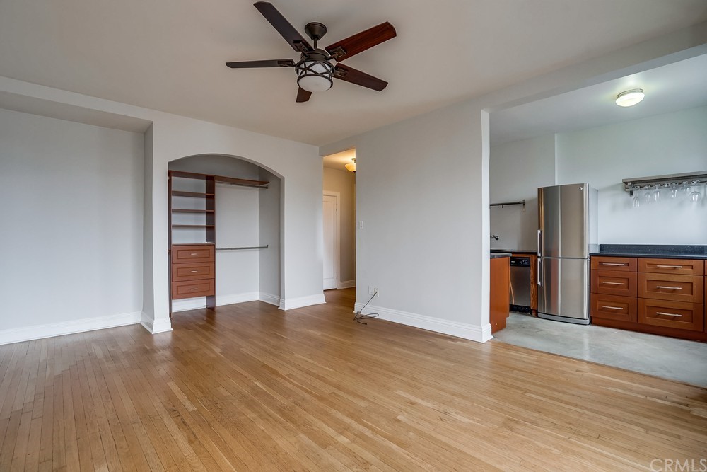 315 West 3rd Street, Unit 507 Long Beach, CA 90802 - Photo 8 of 25 wooden floor in an empty room with a window