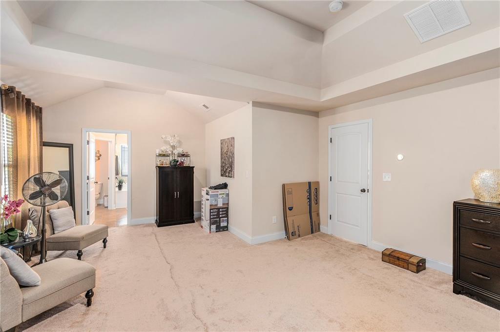 1419 Stone Ridge Court Hampton, GA 30228 - Photo 19 of 31 a view of a livingroom with furniture and windows