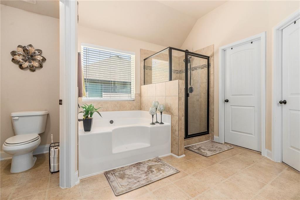 1419 Stone Ridge Court Hampton, GA 30228 - Photo 21 of 31 a spacious bathroom with a bathtub shower sink and toilet