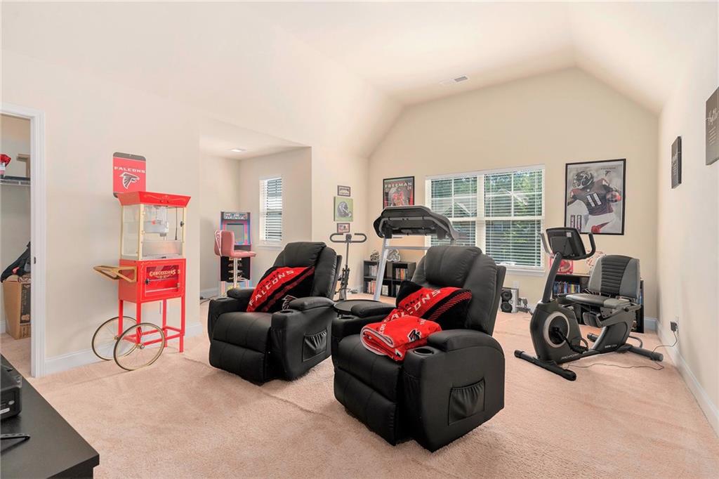 1419 Stone Ridge Court Hampton, GA 30228 - Photo 23 of 31 a living room with furniture and a flat screen tv