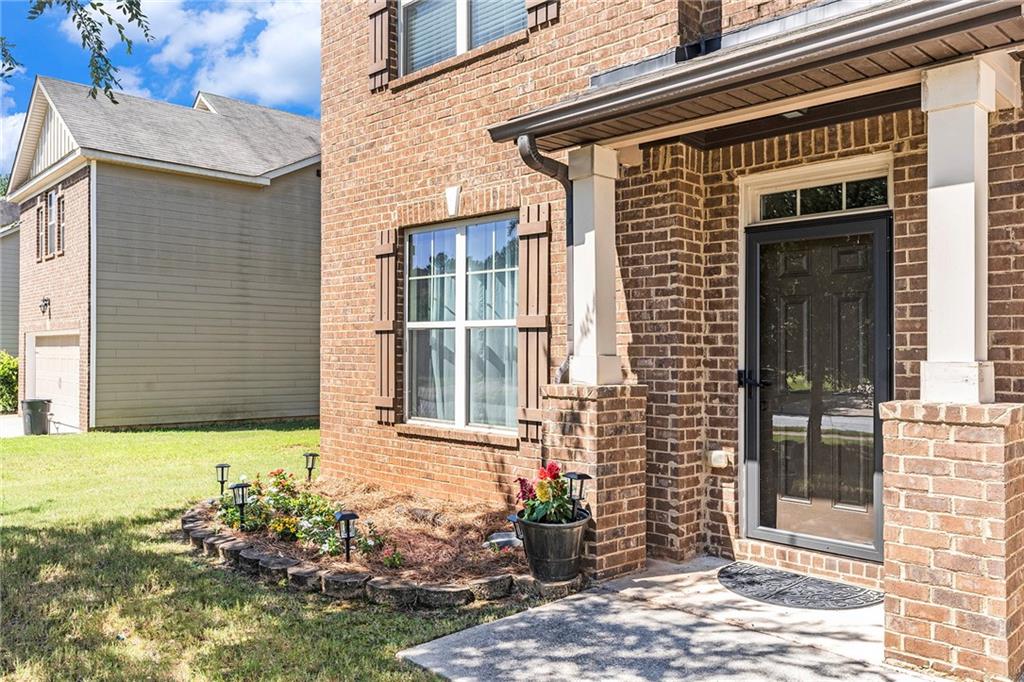 1419 Stone Ridge Court Hampton, GA 30228 - Photo 3 of 31 a front view of a house with a yard