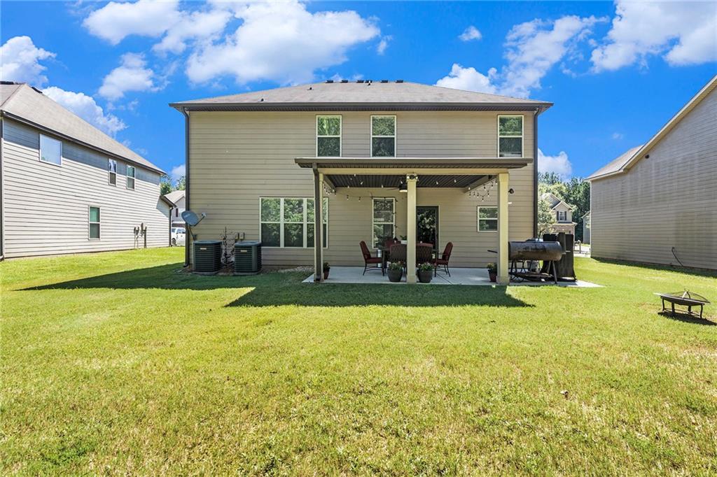 1419 Stone Ridge Court Hampton, GA 30228 - Photo 31 of 31 a view of a house with swimming pool and porch