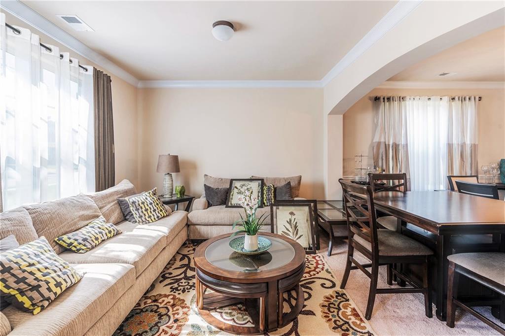 1419 Stone Ridge Court Hampton, GA 30228 - Photo 4 of 31 a living room with furniture and a large window