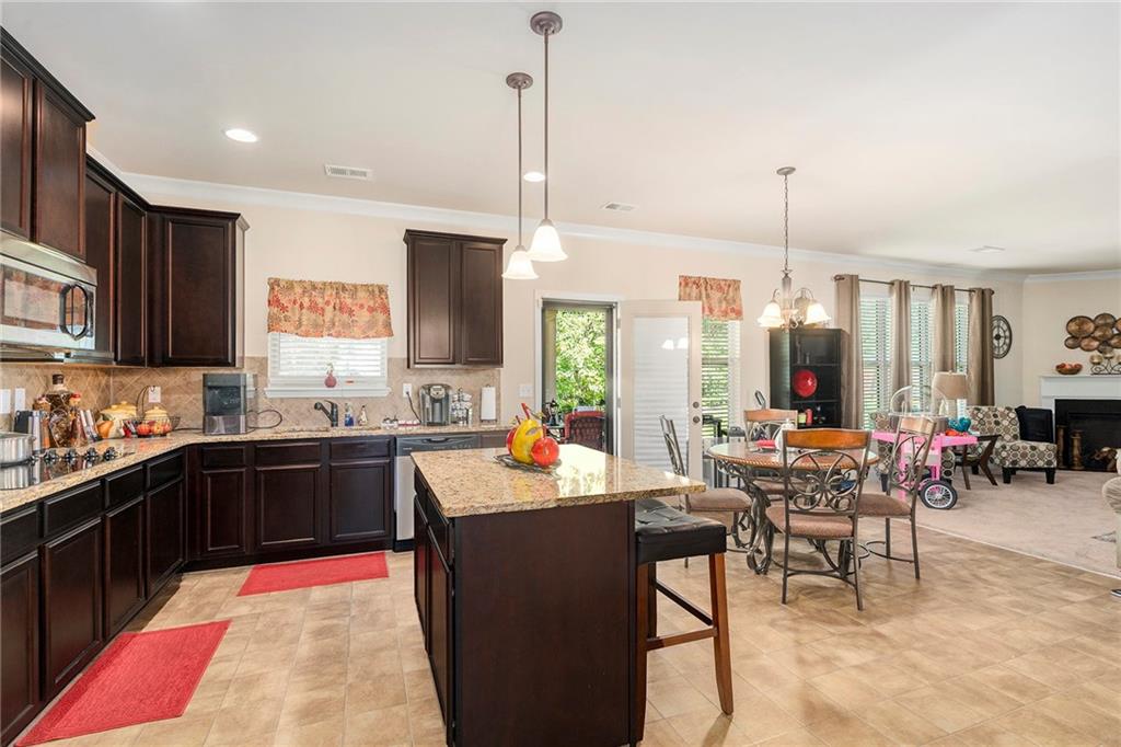 1419 Stone Ridge Court Hampton, GA 30228 - Photo 9 of 31 a large kitchen with lots of counter top space and stainless steel appliances