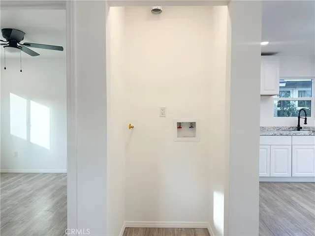 a bathroom with a granite countertop sink and vanity