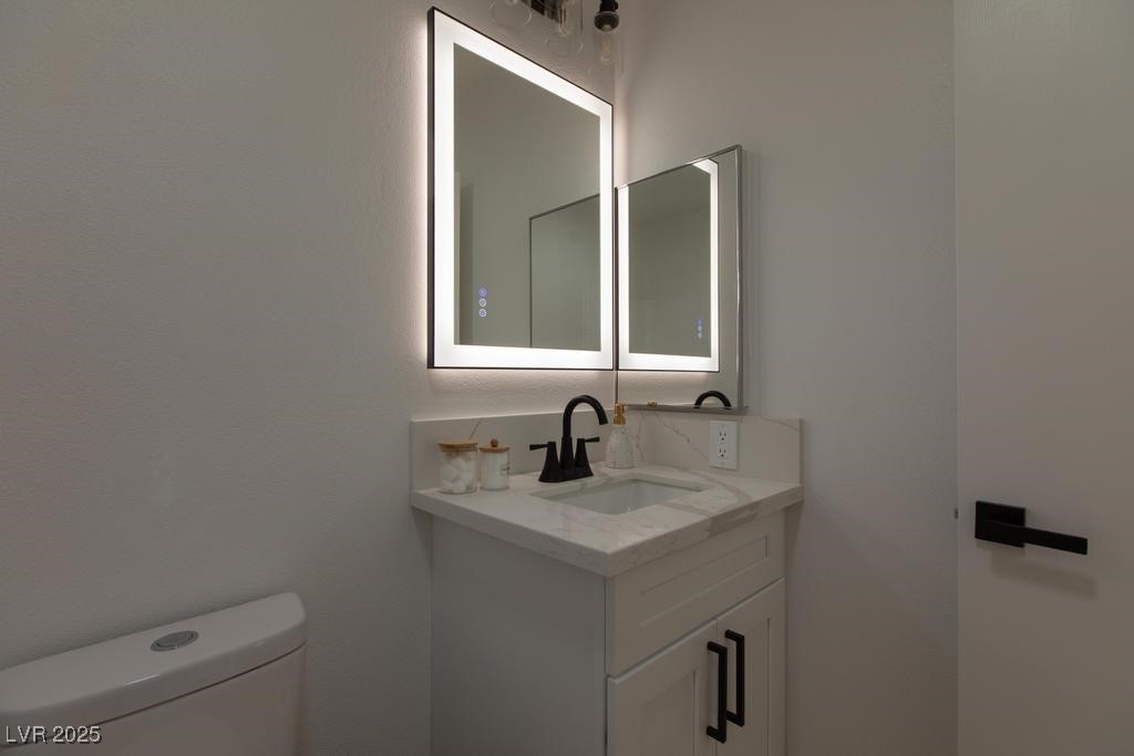 502 Edgefield Ridge Place Henderson, NV 89012 - Photo 27 of 38 Bathroom with toilet and vanity