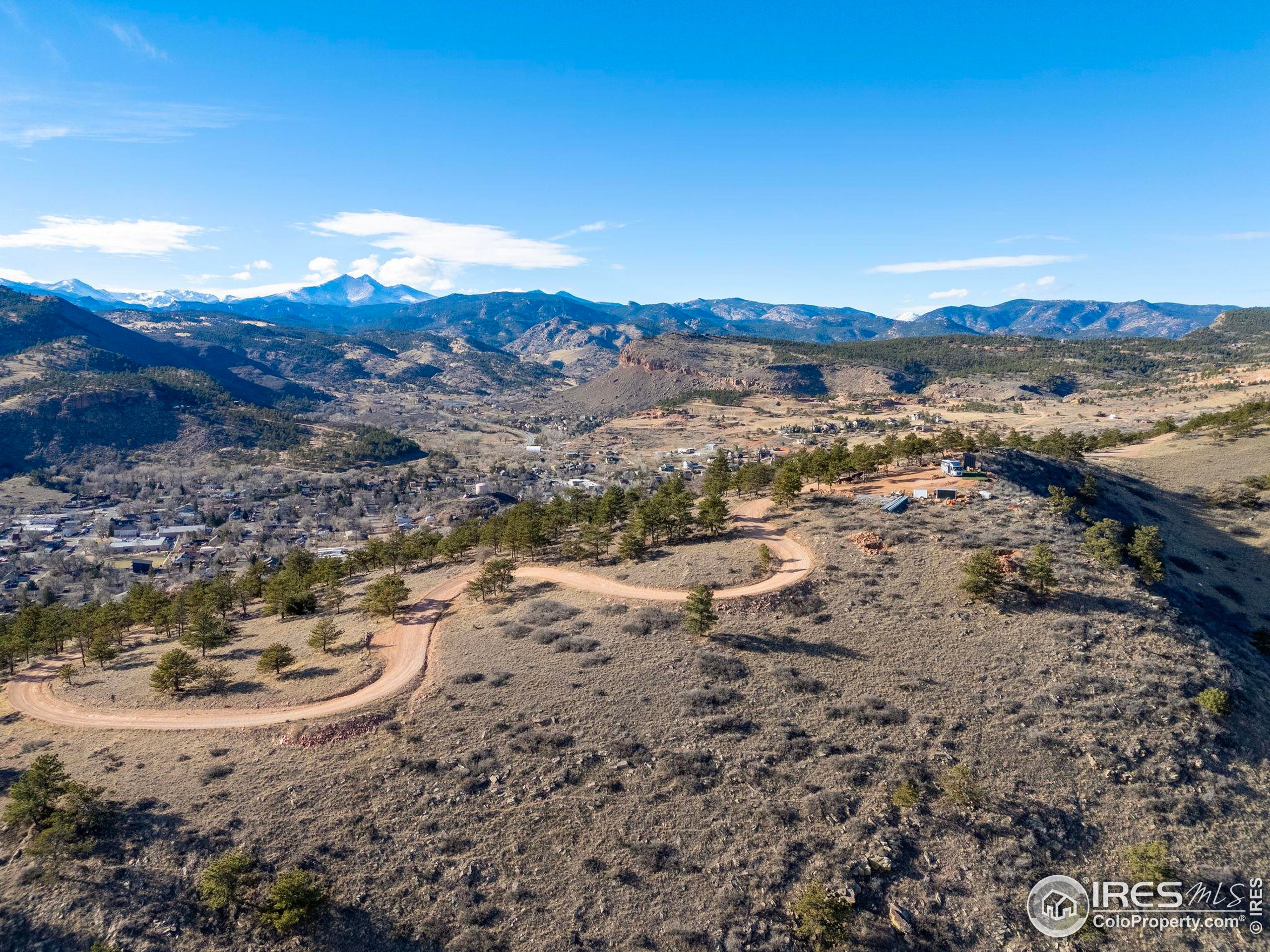 1285 Eagle Ridge Road Lyons, CO 80540 - Photo 16 of 22 a view of a lake with mountains in the background