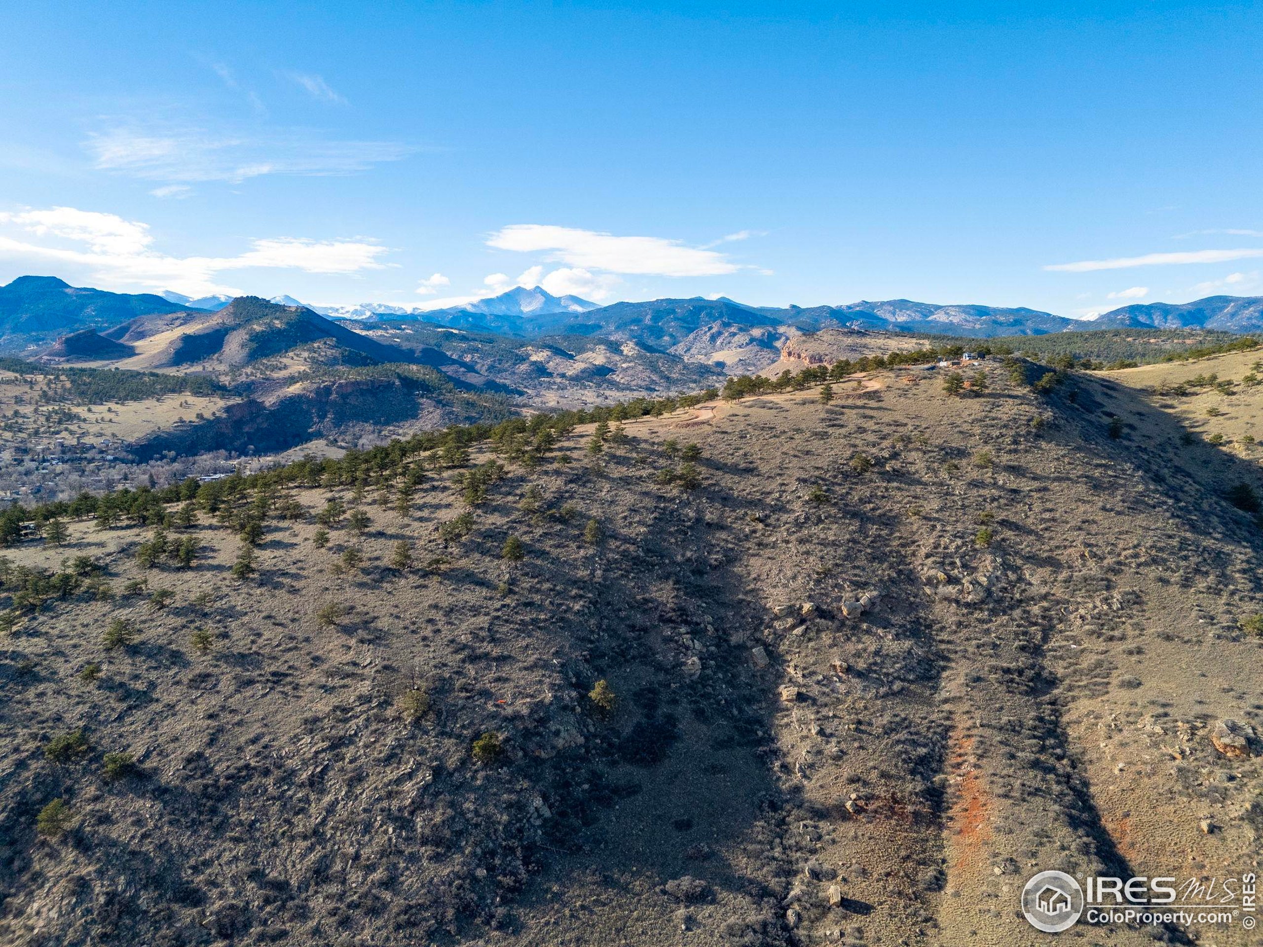 1285 Eagle Ridge Road Lyons, CO 80540 - Photo 5 of 22 a view of a lake with mountains in the background