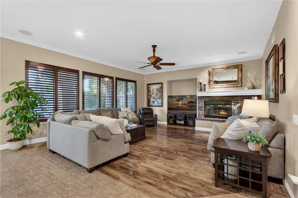 a kitchen with stainless steel appliances granite countertop a refrigerator a stove and a sink