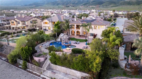 a view of a swimming pool with a yard