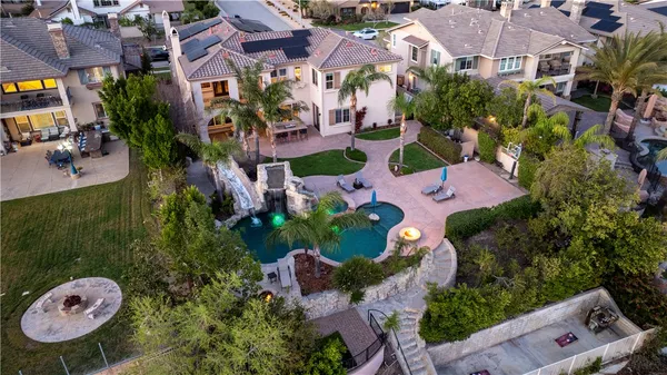 a backyard of a house with table and chairs