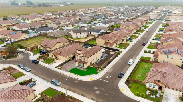 an aerial view of a house with a swimming pool