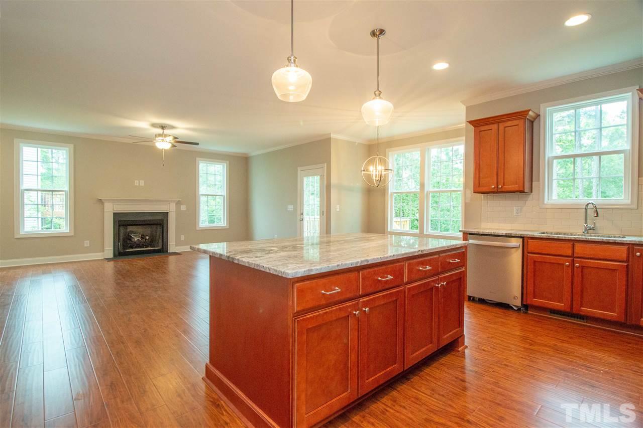 4202 Prelude Street Raleigh, NC 27616 - Photo 5 of 21 Oversized center island in kitchen; level 3 granite!
