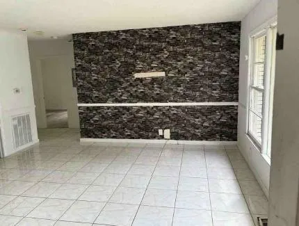 a kitchen with granite countertop a sink and a stove top oven