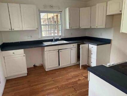 904 Barbara Circle Southwest Moultrie, GA 31768 - Photo 13 of 20 a kitchen with granite countertop a sink and a stove top oven