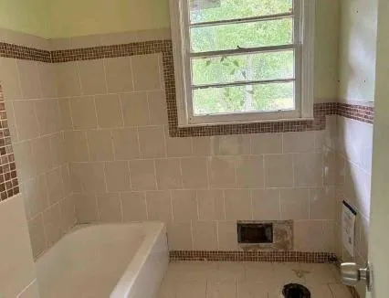 a bathroom with a shower and a bathtub