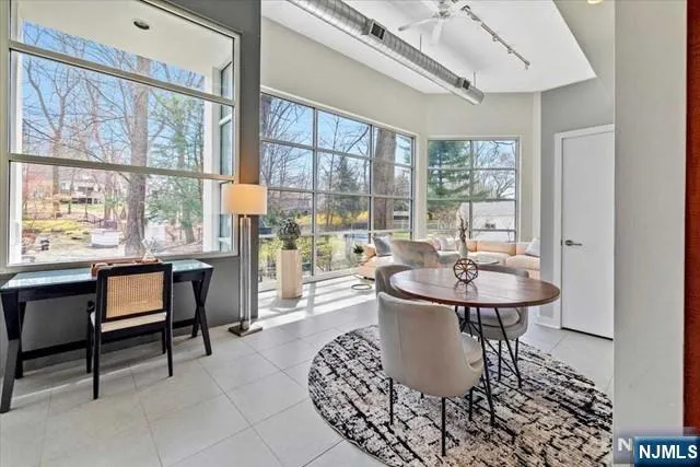 a view of a dining room with furniture window and outside view