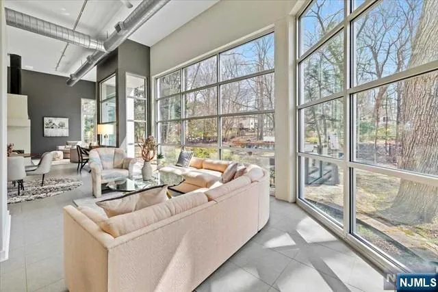 a living room with large windows