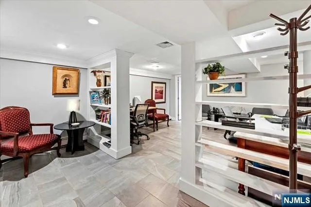 a view of living room filled with furniture and rug