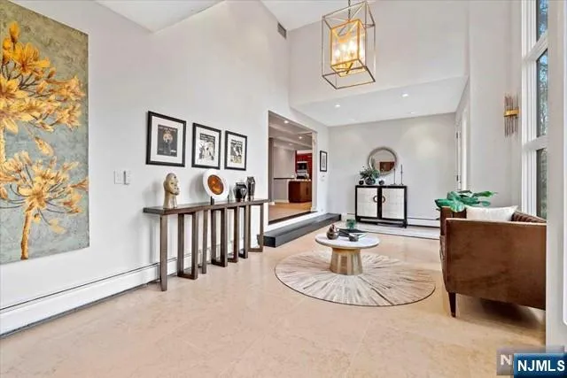 a living room with furniture and a table