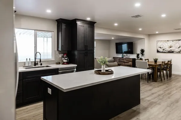 a kitchen with a sink and cabinets