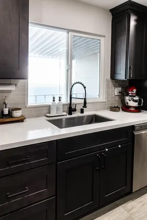 a kitchen with a sink and a window
