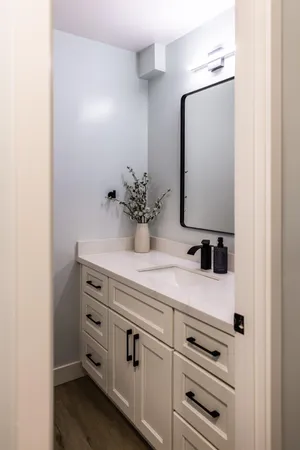 a white toilet sitting next to a sink