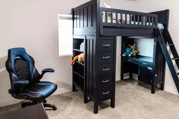 a bed room with a bed and a tv