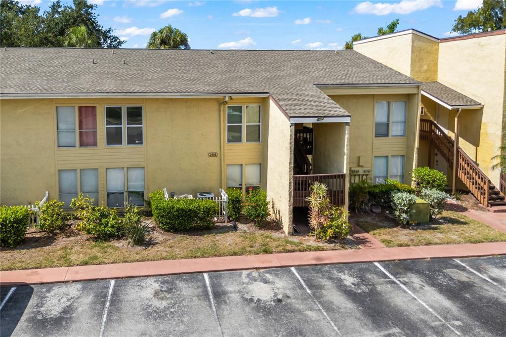 3405 Clark Road, Unit 205 Sarasota, FL 34231 - Photo 2 of 28 a front view of a house with a yard