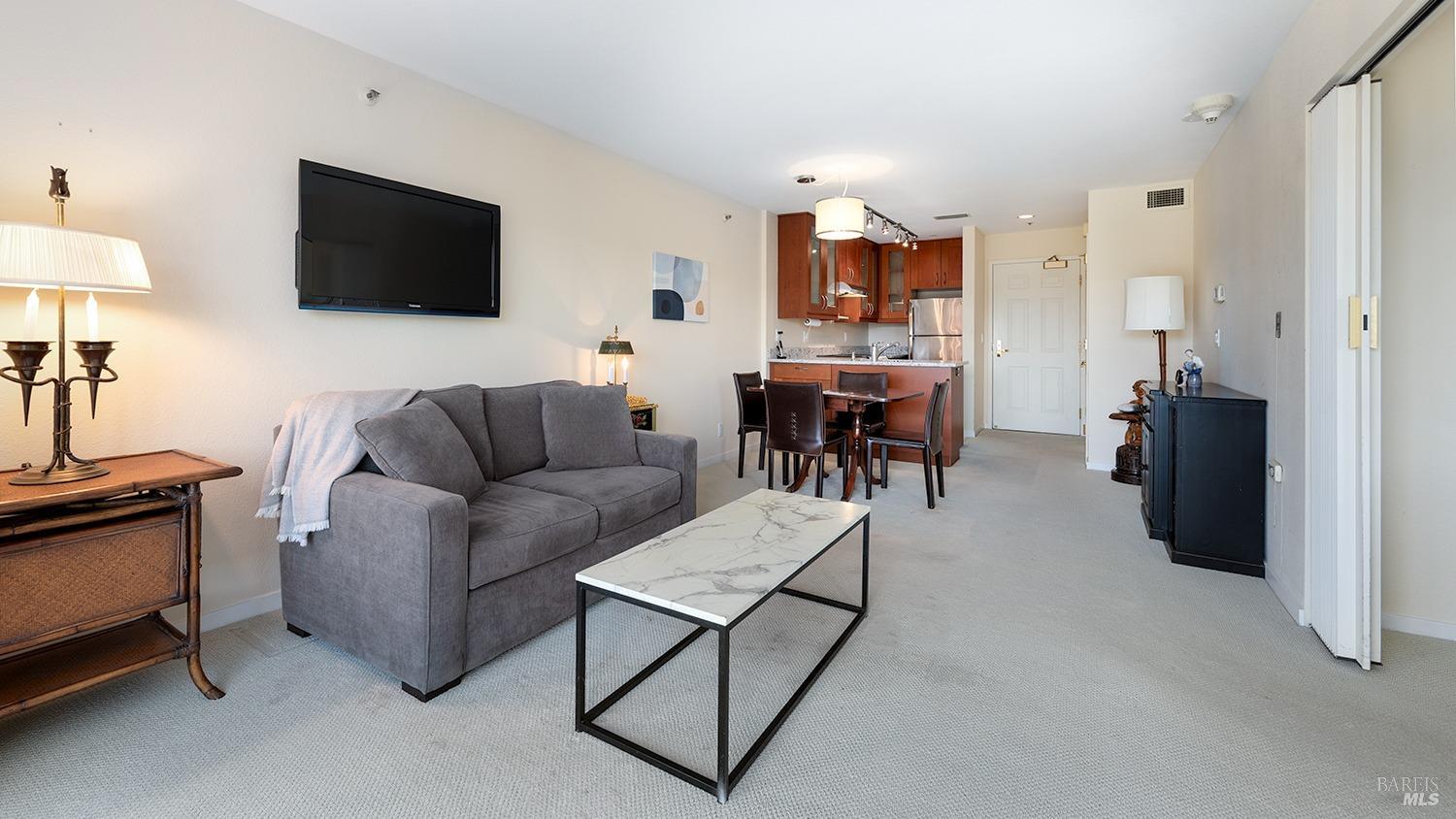 100 Thorndale Drive, Unit 450 San Rafael, CA 94903 - Photo 13 of 24 a living room with furniture and a flat screen tv