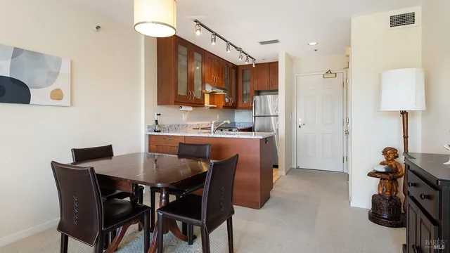 a view of a dining room and a livingroom with furniture