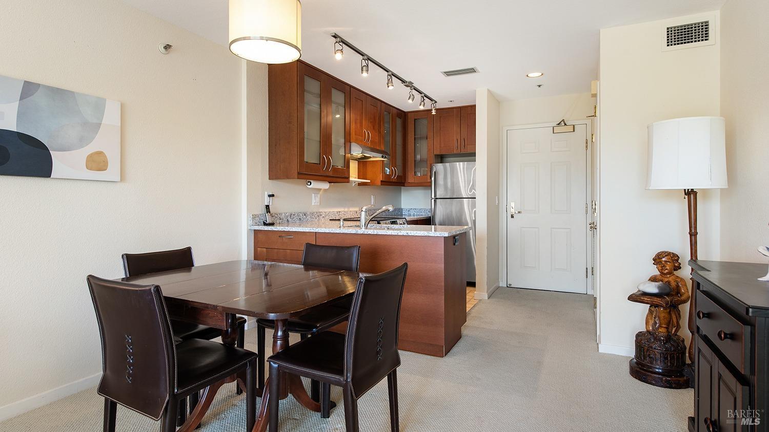 100 Thorndale Drive, Unit 450 San Rafael, CA 94903 - Photo 14 of 24 a view of a dining room and a livingroom with furniture