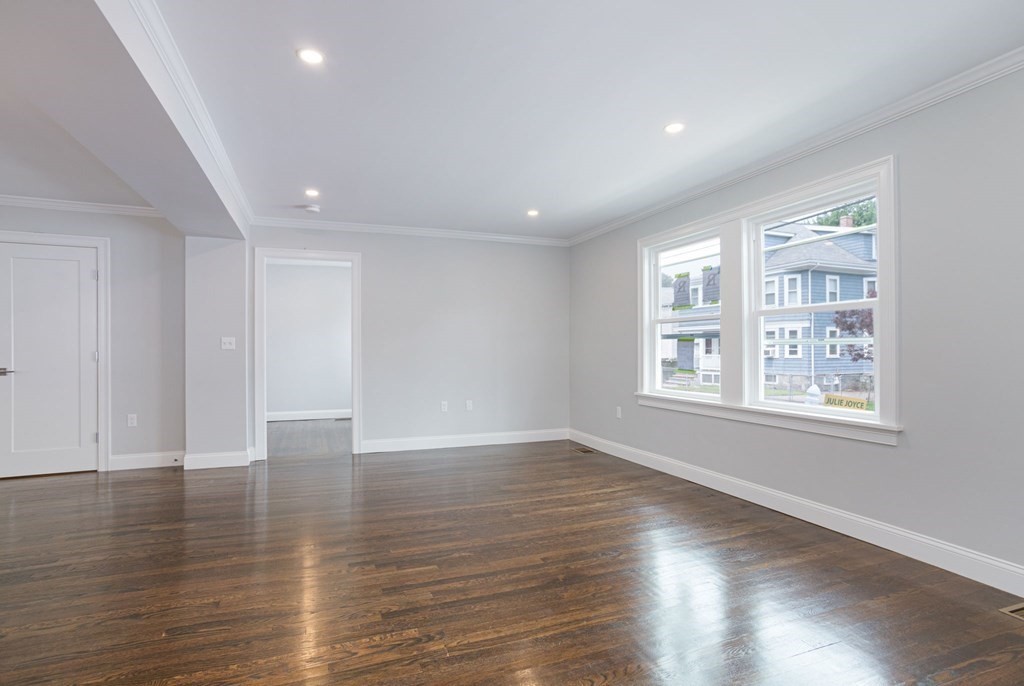34 Brookvale Street Boston, MA 02124 - Photo 12 of 36 an empty room with wooden floor and windows