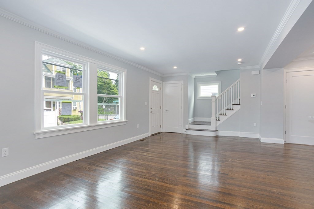34 Brookvale Street Boston, MA 02124 - Photo 13 of 36 an empty room with wooden floor and windows
