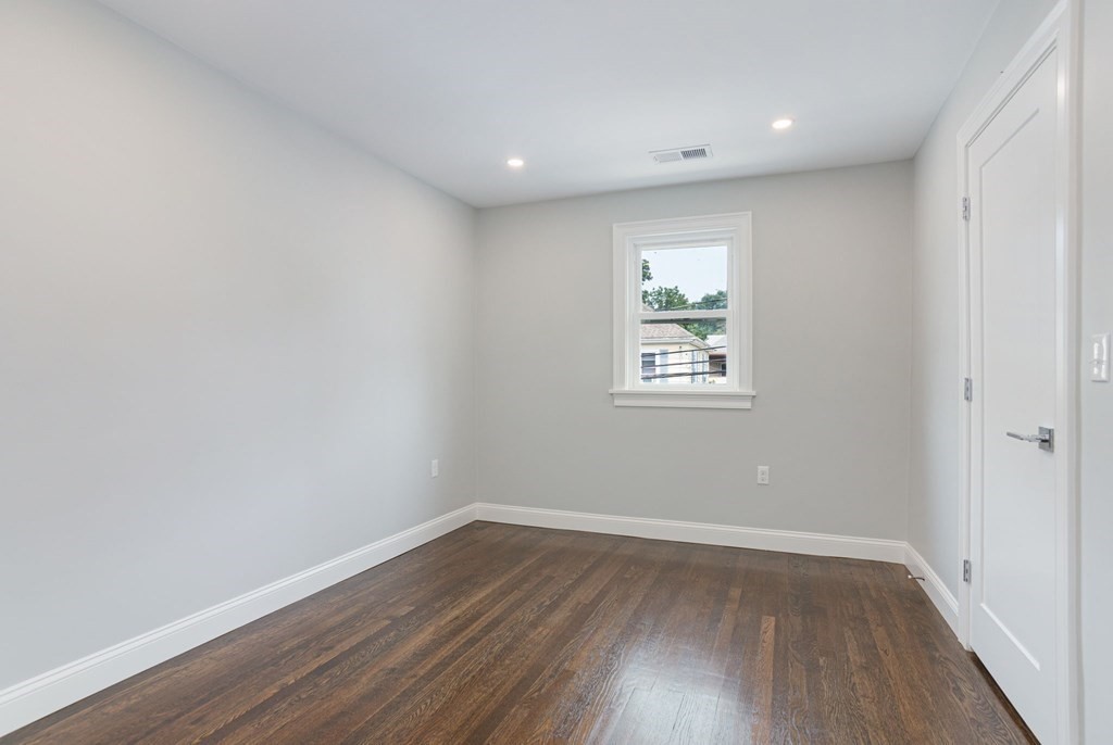 34 Brookvale Street Boston, MA 02124 - Photo 18 of 36 a view of room with wooden floor and window