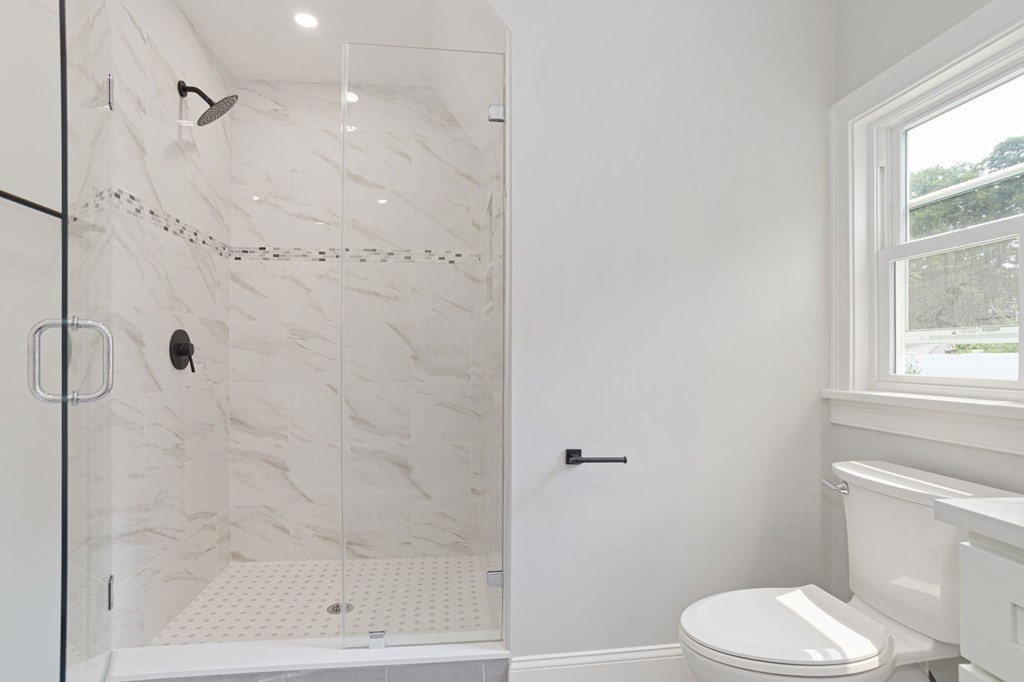 34 Brookvale Street Boston, MA 02124 - Photo 20 of 36 a bathroom with a shower and a toilet