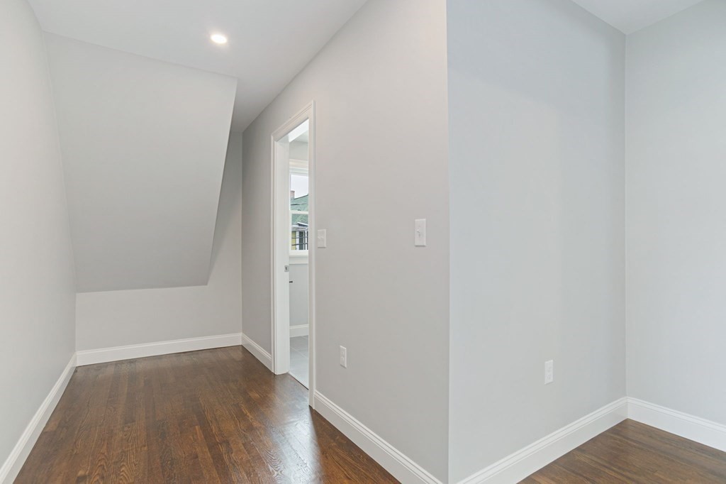 34 Brookvale Street Boston, MA 02124 - Photo 24 of 36 a view of hallway with wooden floor