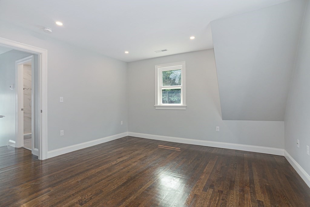 34 Brookvale Street Boston, MA 02124 - Photo 25 of 36 wooden floor in an empty room with a window
