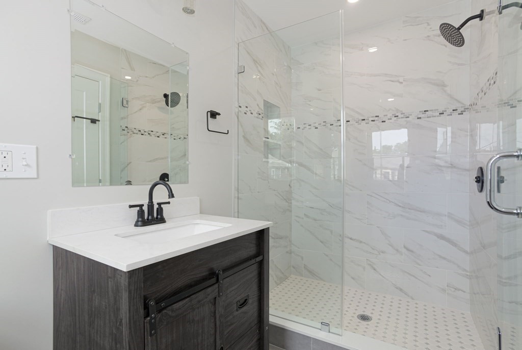 34 Brookvale Street Boston, MA 02124 - Photo 27 of 36 a bathroom with a sink shower and a mirror