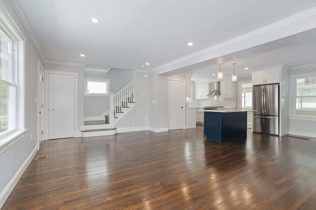 34 Brookvale Street Boston, MA 02124 - Photo 4 of 36 an empty room with wooden floor and windows