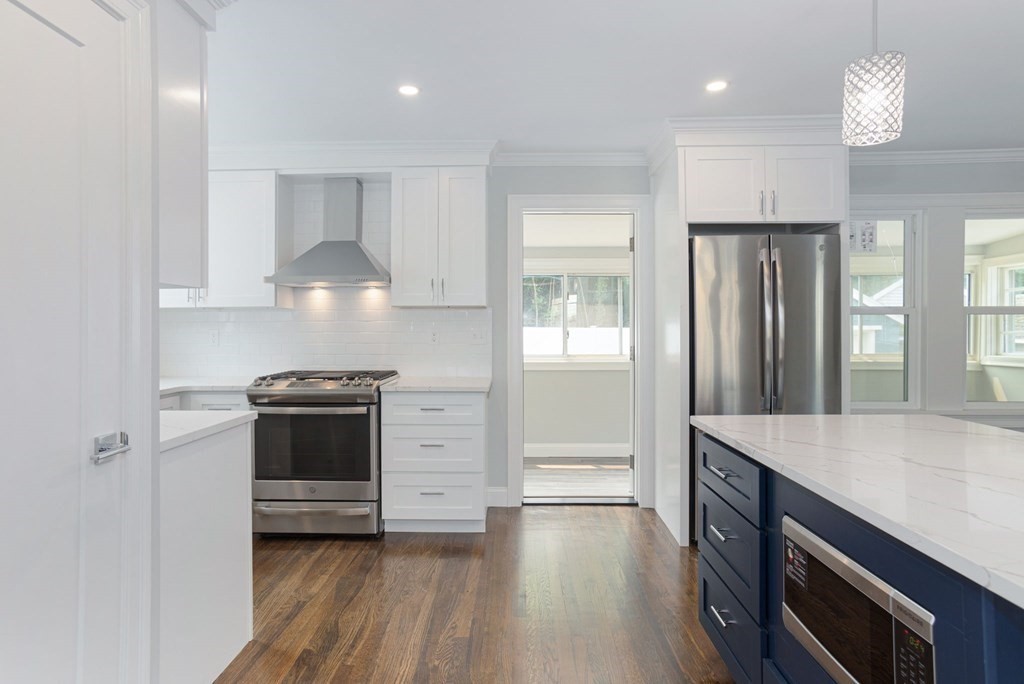 34 Brookvale Street Boston, MA 02124 - Photo 10 of 36 a kitchen with stainless steel appliances a stove and a refrigerator