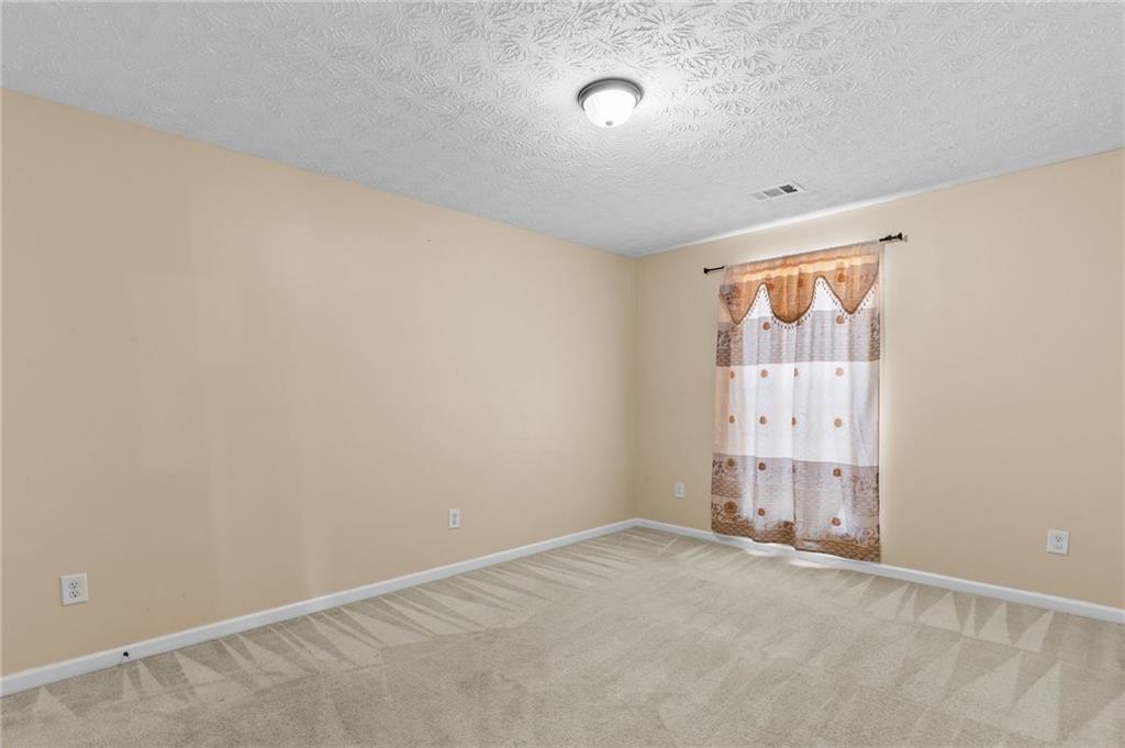 2760 Rusticwood Drive Southwest Snellville, GA 30078 - Photo 37 of 48 an empty room with window