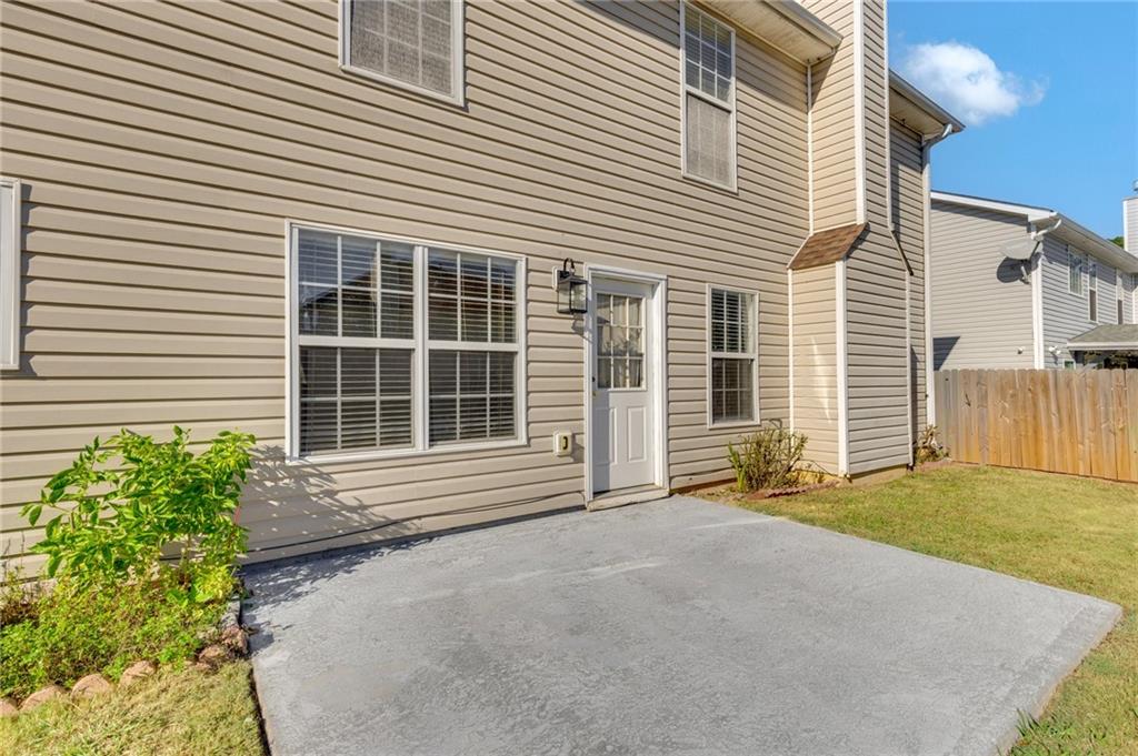 2760 Rusticwood Drive Southwest Snellville, GA 30078 - Photo 47 of 48 a front view of a house with a yard