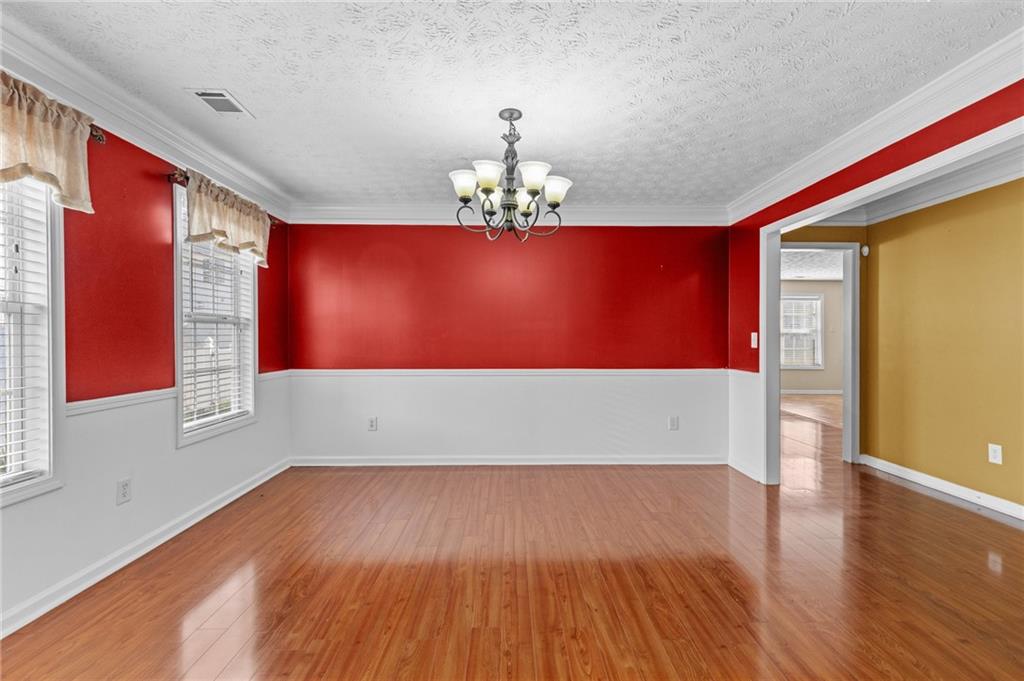 2760 Rusticwood Drive Southwest Snellville, GA 30078 - Photo 10 of 48 a view of empty room with wooden floor